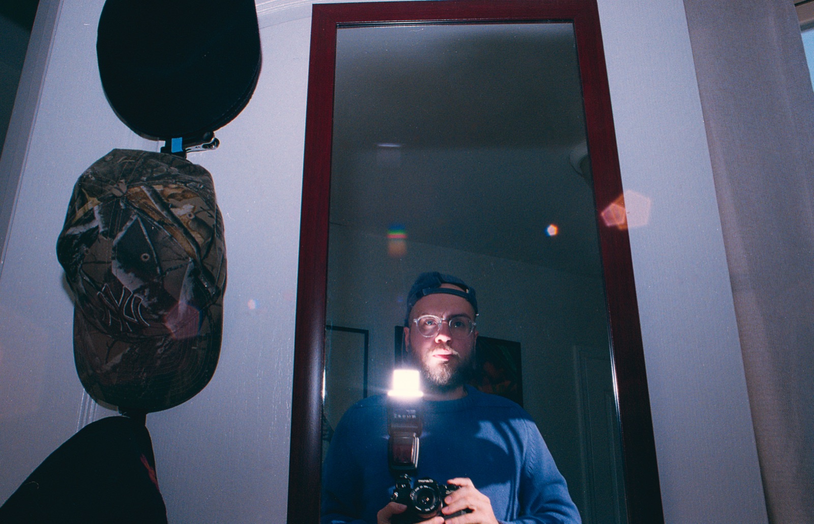 Lucas O.M. — self-portrait with camera in a mirror